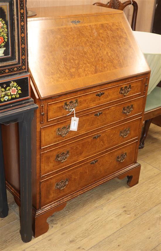 A reproduction walnut bureau W.81cm